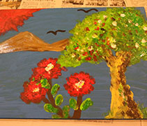 與老師溝通後，楊秀蓉意識到畫中的三朵紅花代表著自己的三名子女，而自己則如大樹般，為他們遮風擋雨。【攝影者：洪繪萍】